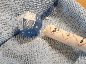 the dice being painted using filler paint