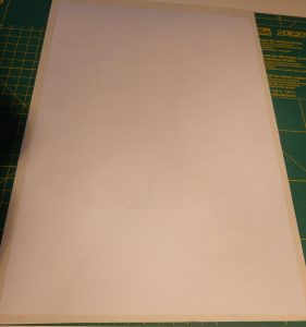 Backside of sheet with airship design, showing the raised folding lines after embossing.
