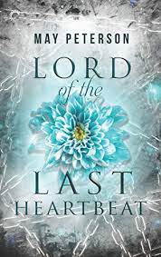 The image shows the cover of May Peterson's 'Lord of the Last Heartbeat' In the centre of the book is a top down view of a pale blue chrysanthemum, fading in and out behind it and crossing the rest of the cover are silver chains against a grey background.