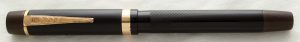 photograph of a black fountain pen with gold detailing