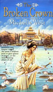 Image shows the cover of Michelle's West's 'The Broken Crown' - book 1 of The Sun Sword series. In the centre front of the image a woman stands in the water, her long white and gold robes trailing beneath the blue. She is holding in her hands a long slightly curved silver sword with a black pommel and gold filigree. Her shoulders are bare and her hair is tied up and adored with jewels and flowers. There are white lilies and lily pads around her. In the background there is a gorgeous building with a 3 tiered pagoda style roof and corner towers. There are trees and a mountain range in the background.