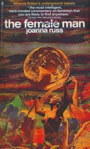 Image contains a cover version of The Female Man. In theimage made up of bronze and orange tones a woman hows her arms up to a moon like planet above her. In the planet is a reflection of her face against the moonscape. The landscape behind the standing figure is made up of versions of her face.