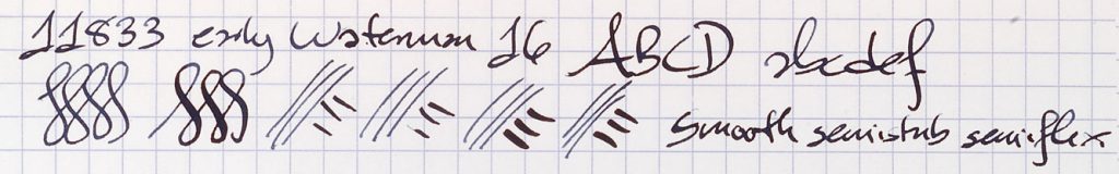 Examples of writing in black ink, including numbers, lower and uppercase letters, and squiggly lines that demonstrate a range of penmanship.