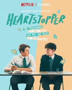 Netflix promotional poster for Heartstopper, featuring Nick and Charlier sitting at a desk and looking at each other