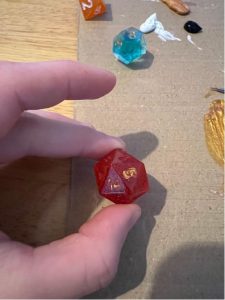 dice being painted with numbers