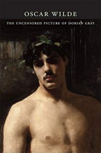 The image is a book cover of 'The Uncensored Dorian Grey' shows an oil painting of a young shirtless young man with a laurel crown on his head.