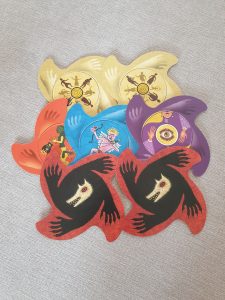 A selection of special cards, including a wolf's head on a black and red background, a cupid on a blue background, a yellow eye on a purple background, and silhouettes of figures in a yellow background.